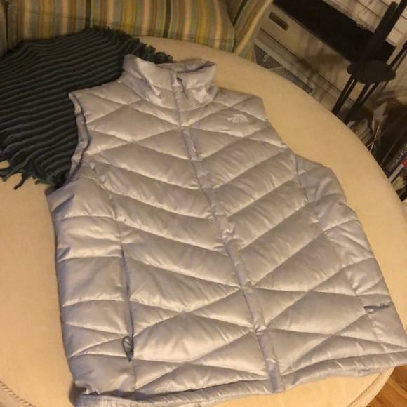 silver north face vest
